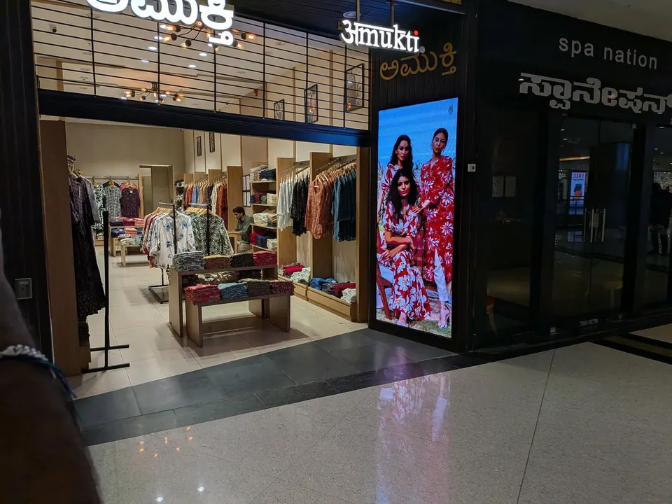 Portrait LED display by PixelSpot at the Amukti apparel store entrance in a Bengaluru mall